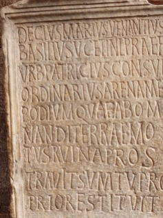 Latin inscription on stone inside the Colosseum
